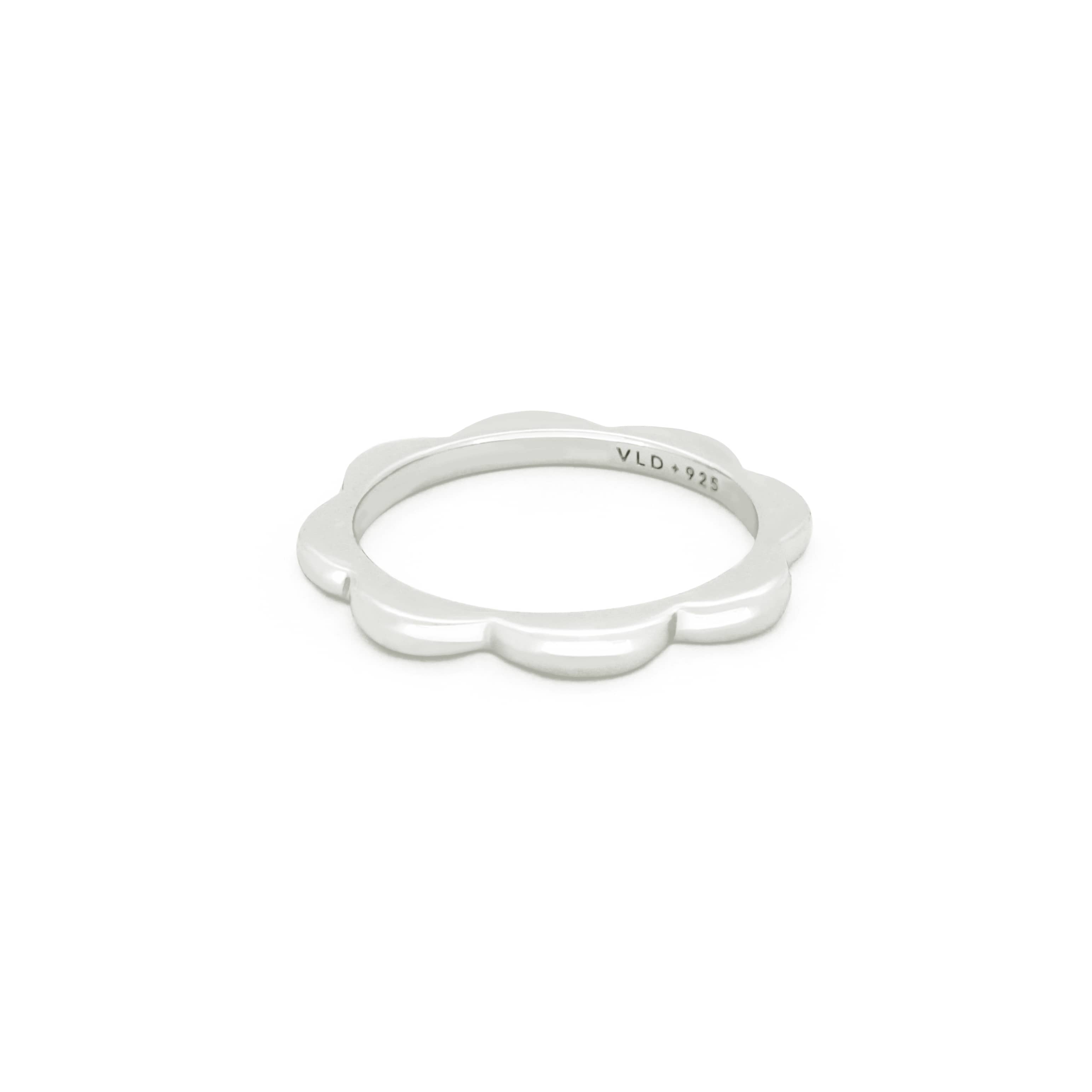 Minimal curvy silver ring with floral-inspired design, ideal for every day stacking.