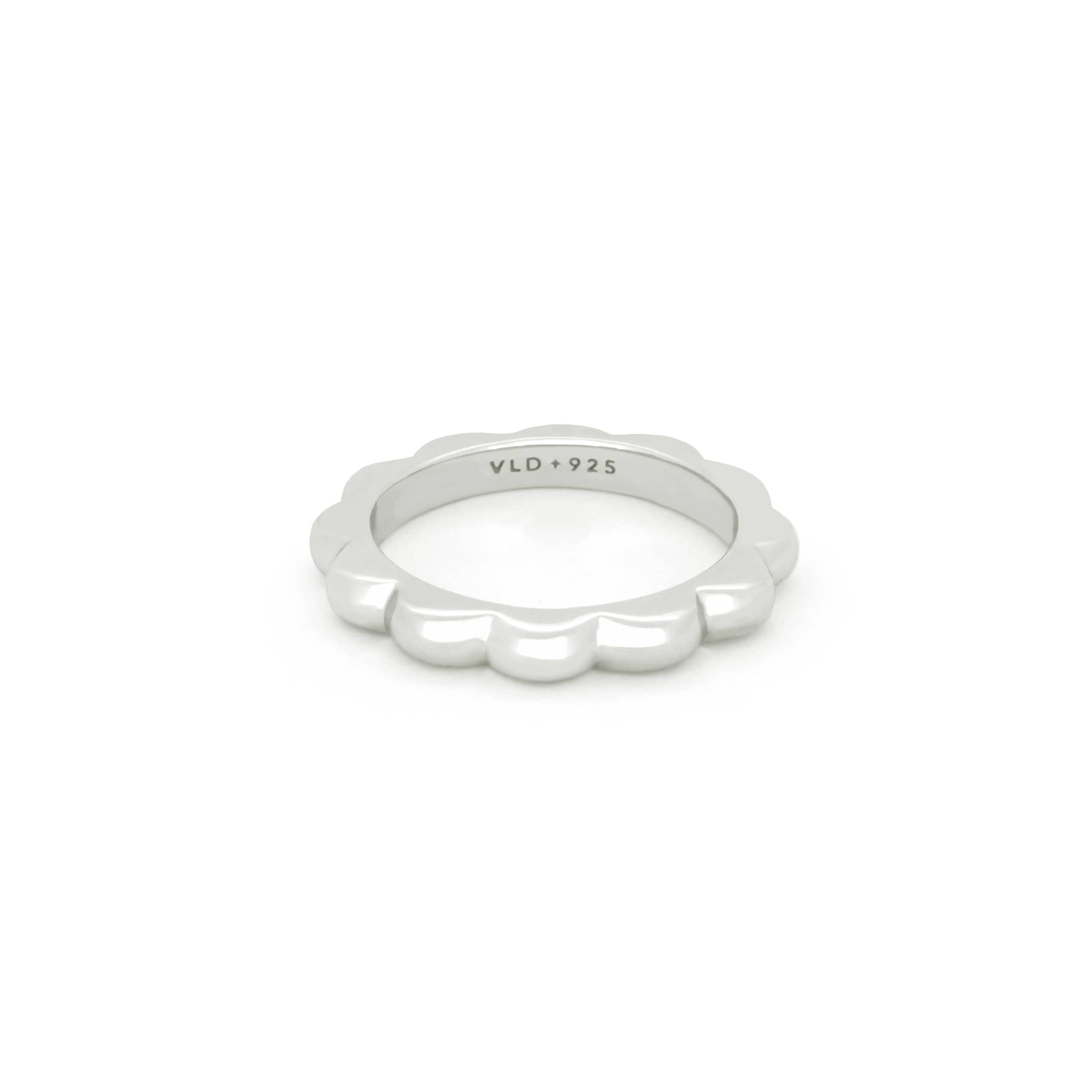 Bold minimal silver stacking ring with a curvy design.