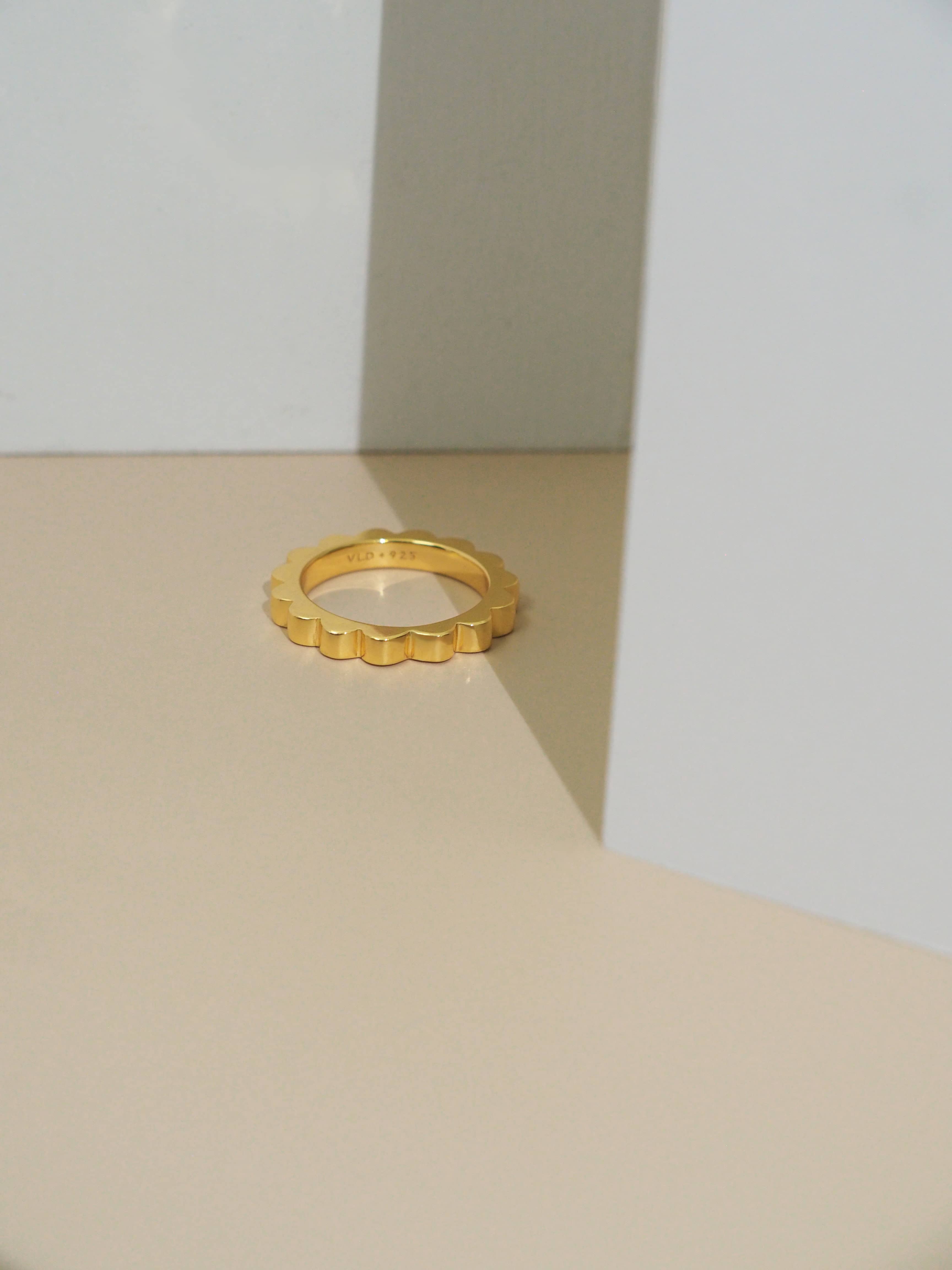 Cool, stylish gold-plated ring perfect for stacking place in natural-color setting.
