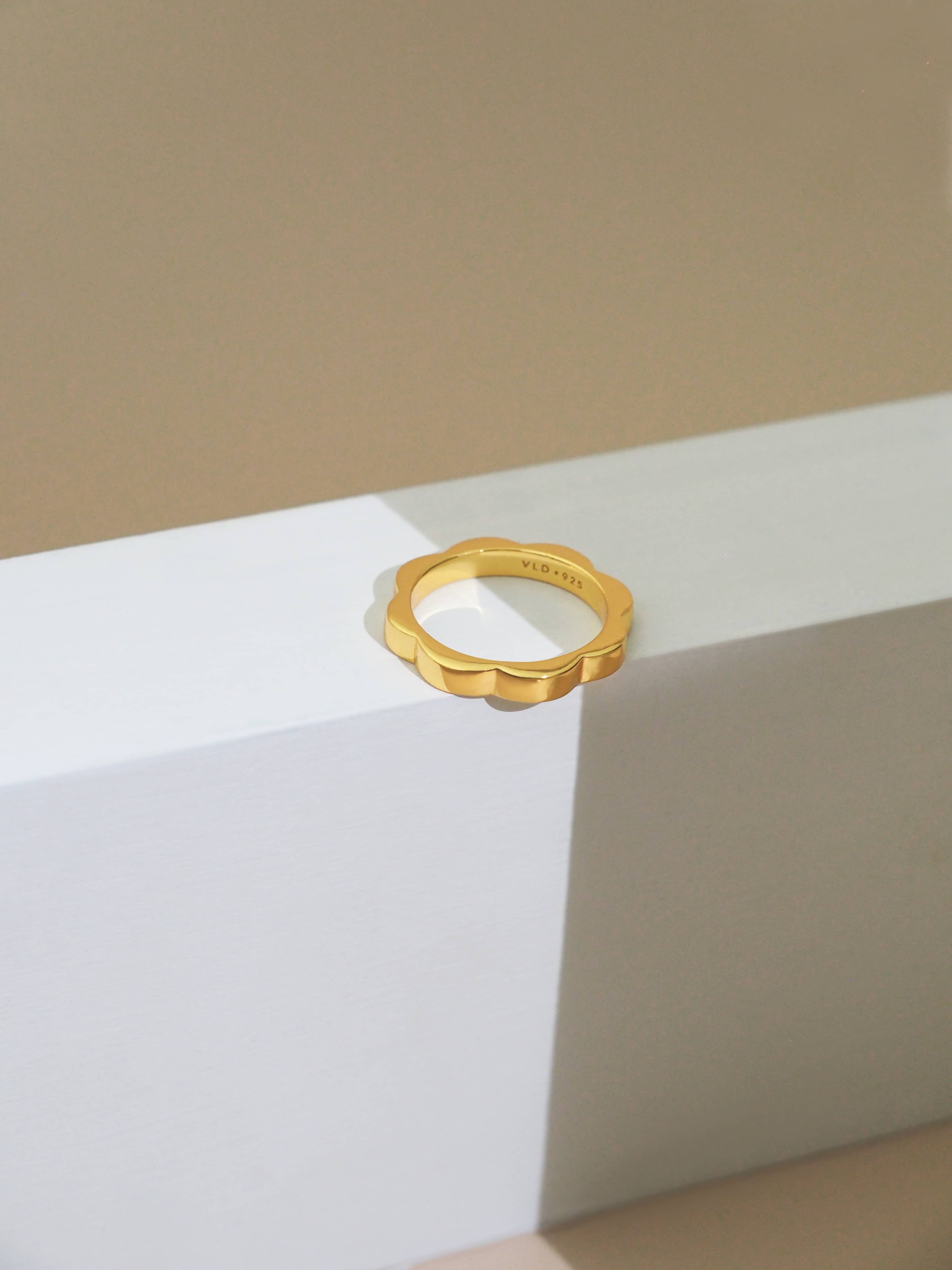 Gold-plated bold stacking ring with a flower design perfect for everyday wear.