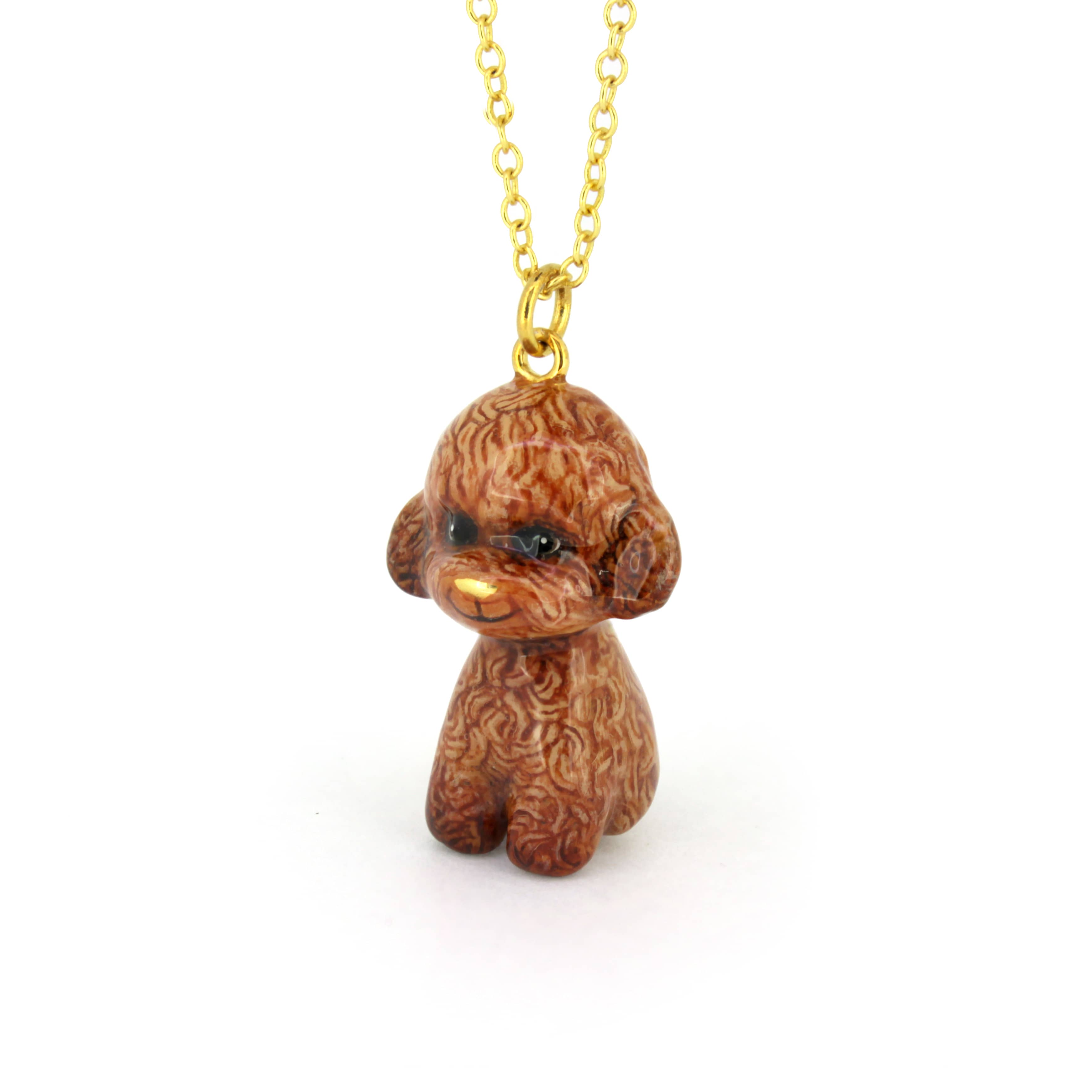 Cute brown poodle pendant with gold necklace chain, perfect jewelry for dog lovers.