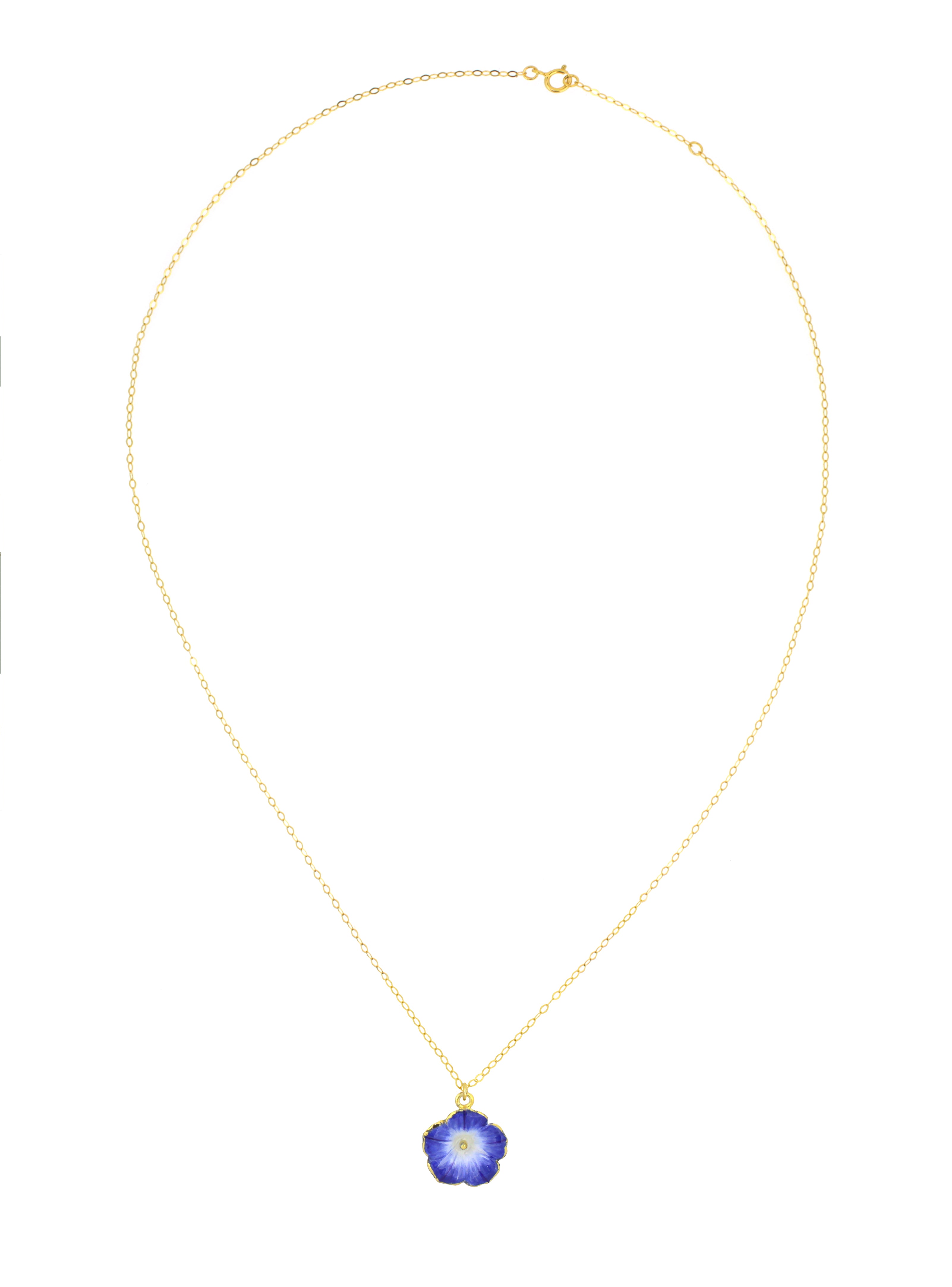 Nature-inspired gold necklace with blue floral designs charm