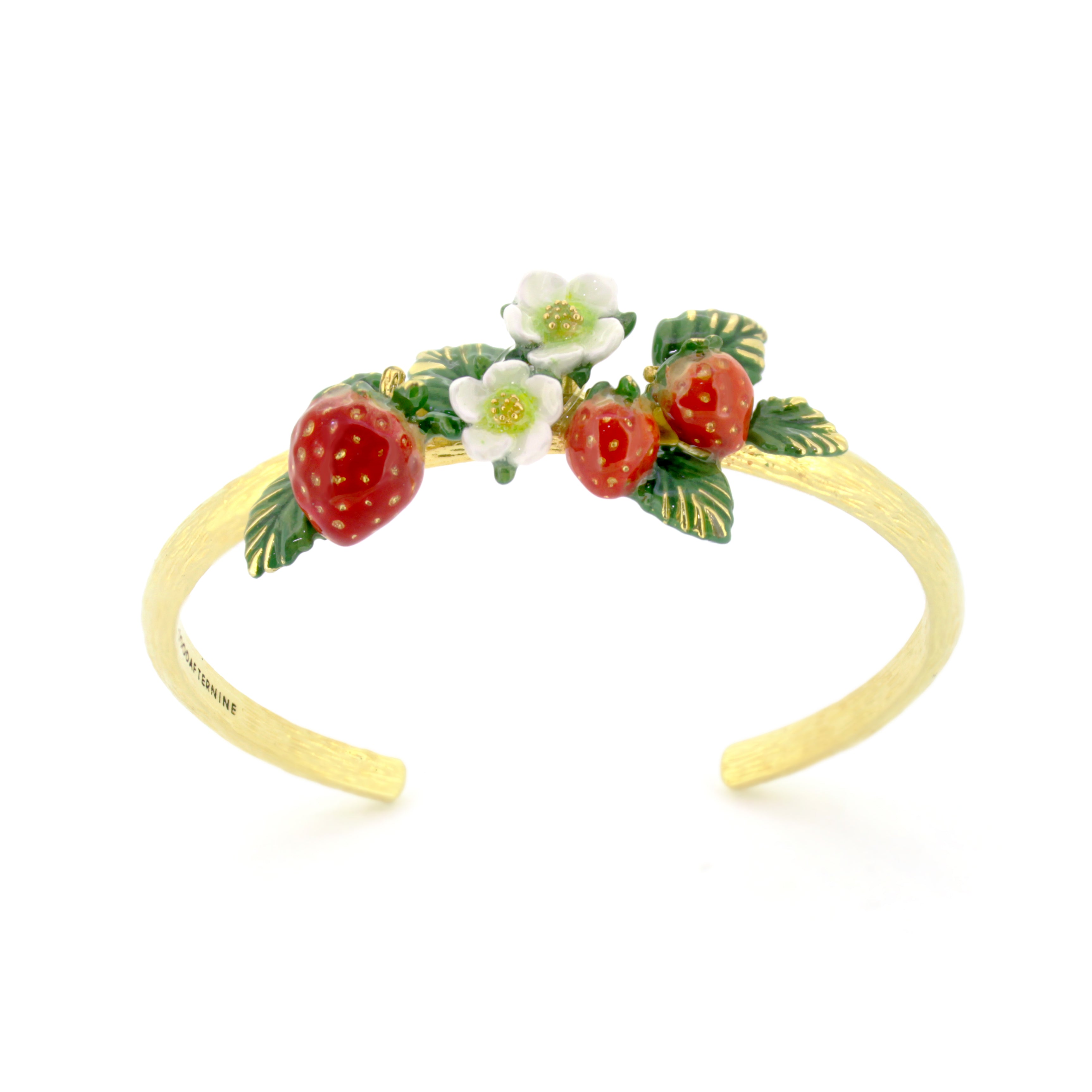 Charming gold bangle adorned with red strawberries and white flowers with green leaves.