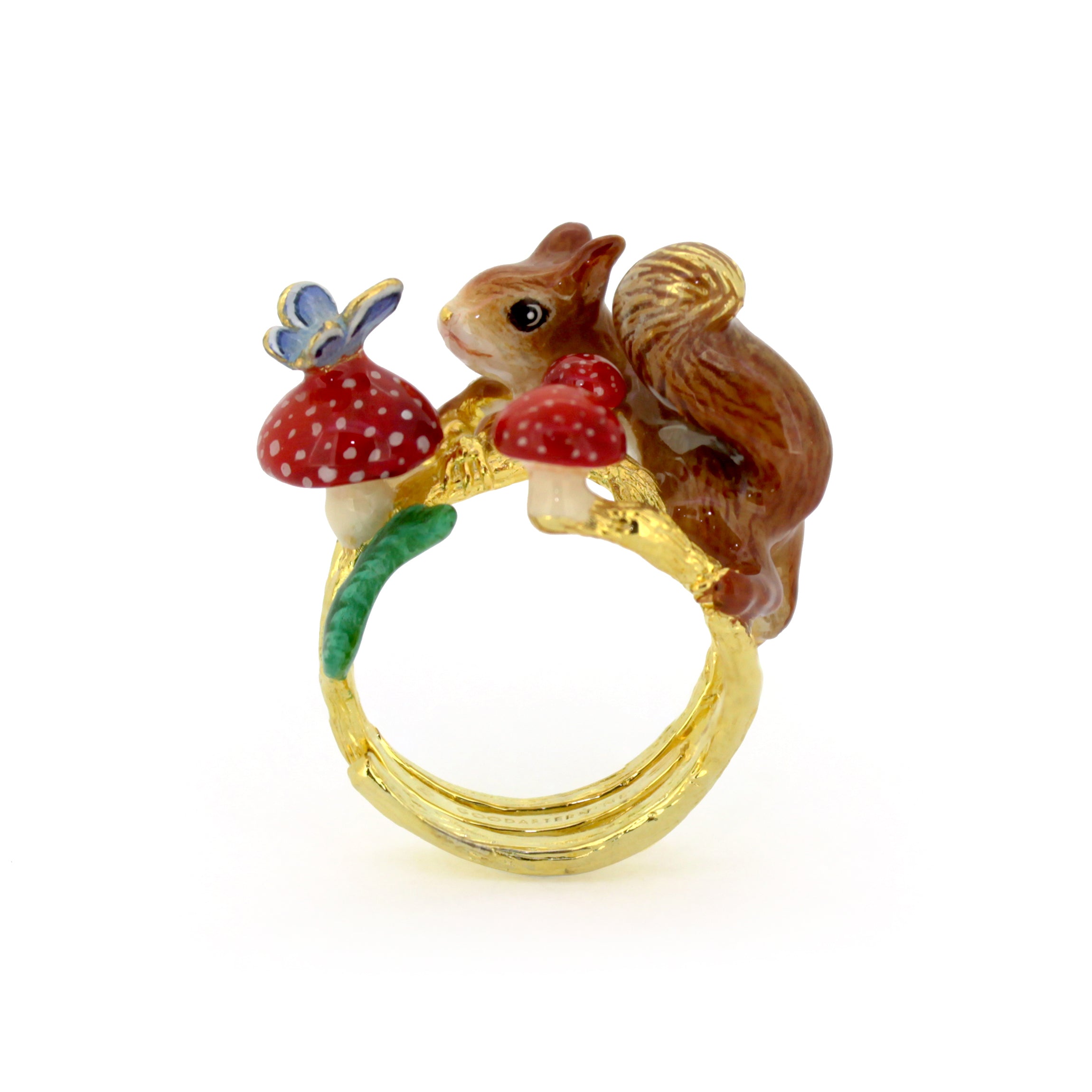 Nature-inspired ring featuring a squirrel, red mushrooms, and a blue butterfly design.