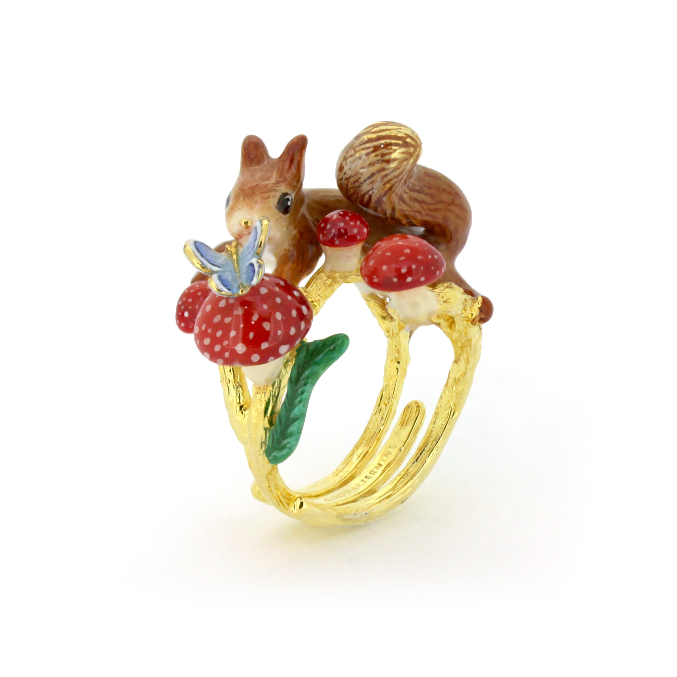 Adorable ring featuring a squirrel, red mushrooms, and a blue butterfly.