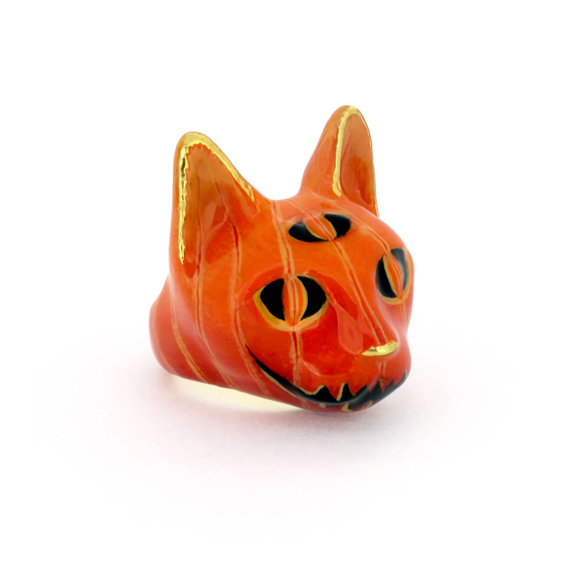 Orange cat head ring with black details, featuring Halloween-themed