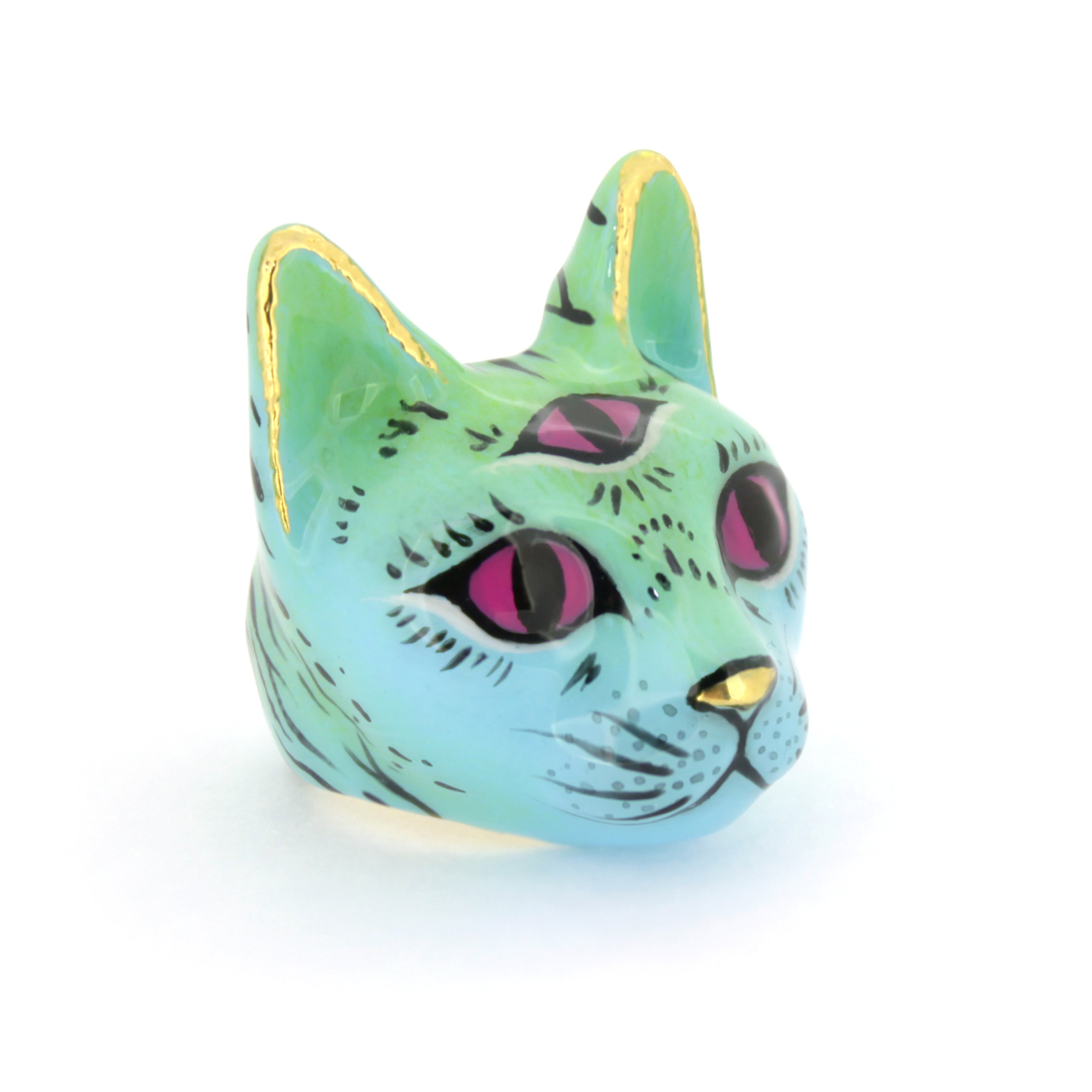 Unique ring featuring a cat's head painted in a vibrant green color, with a purple third eye design.