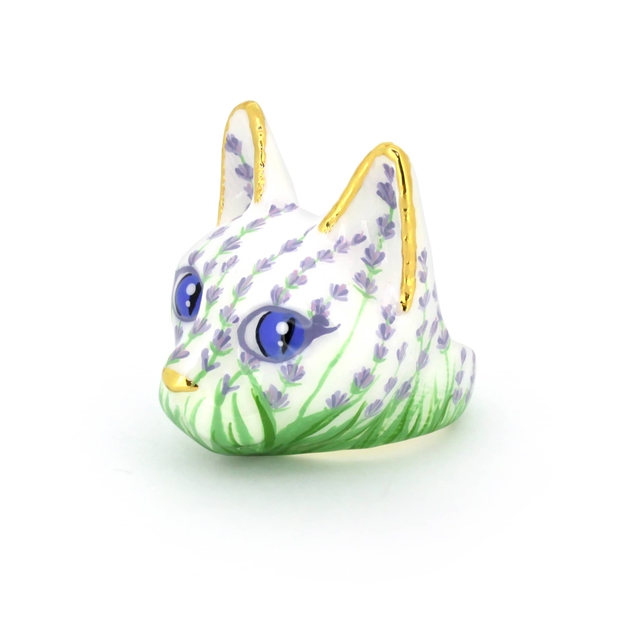 A beautiful cat ring featuring a white base, lavender flowers, and striking blue eyes, with golden detailing on ears.
