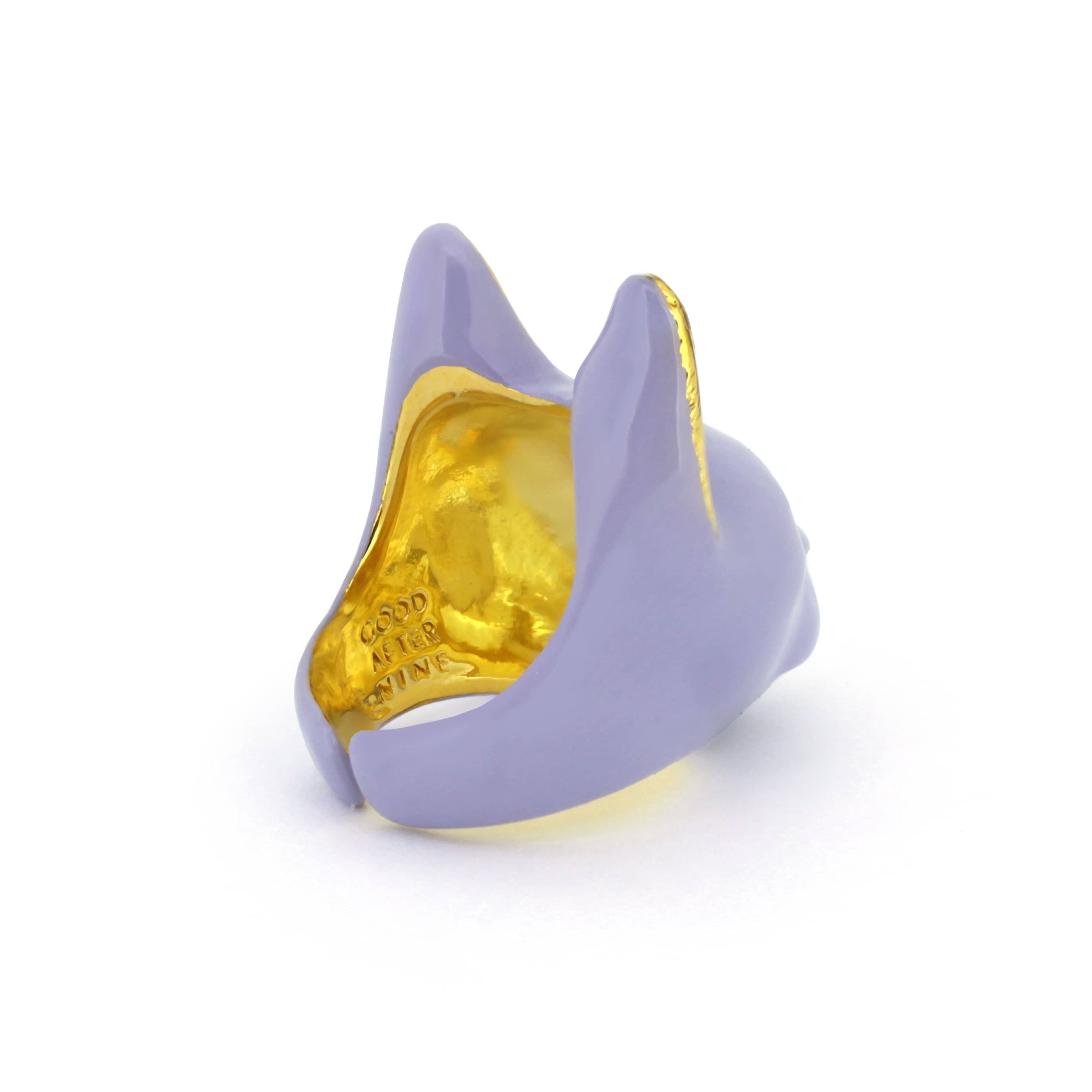 A whimsical ring designed in the shape of a cat’s head, featuring a soft lavender color.