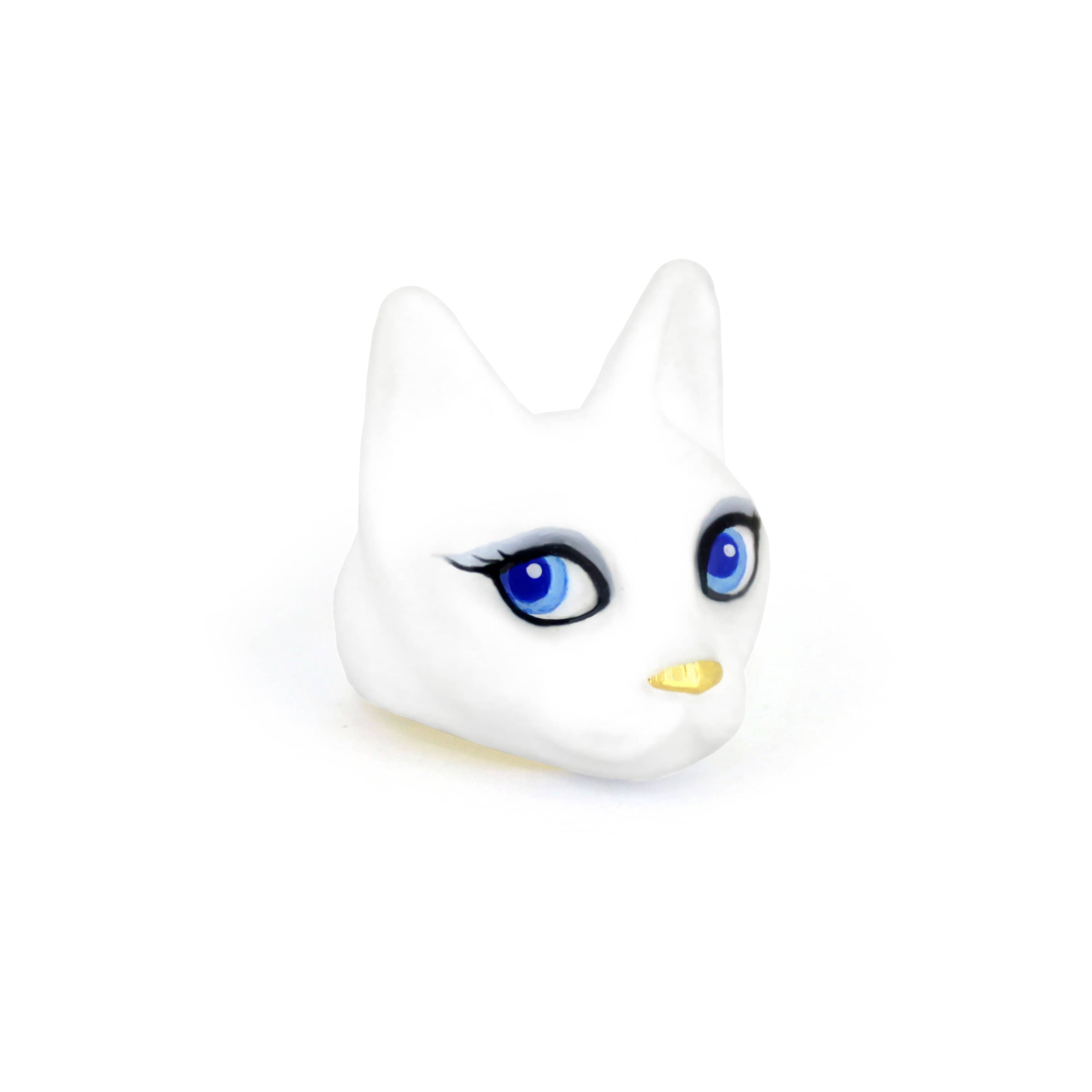 Unique white cat ring with blue eyes, perfect for cat lovers and art collectors.