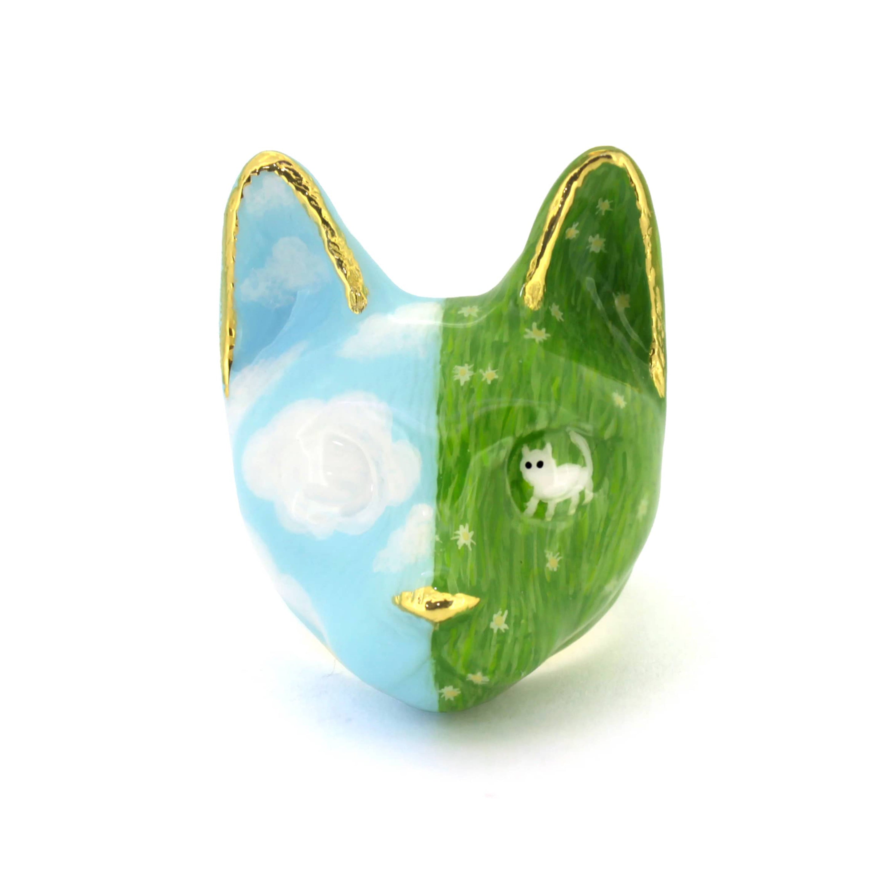 Hand-painted cat ring featuring a blue sky and a white cat in a green grass field.