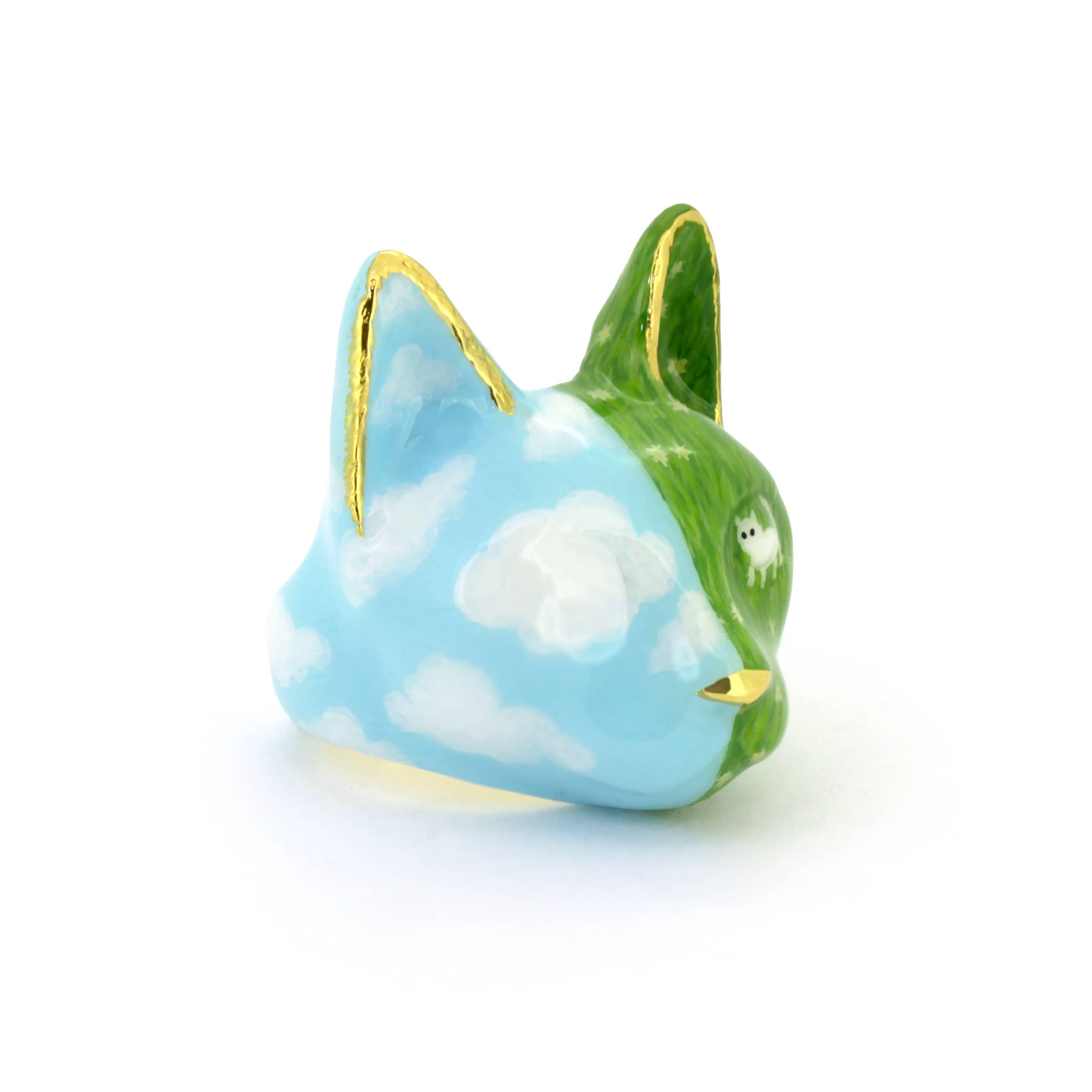 Hand-painted cat ring featuring a blue sky and a white cat in a green grass field.