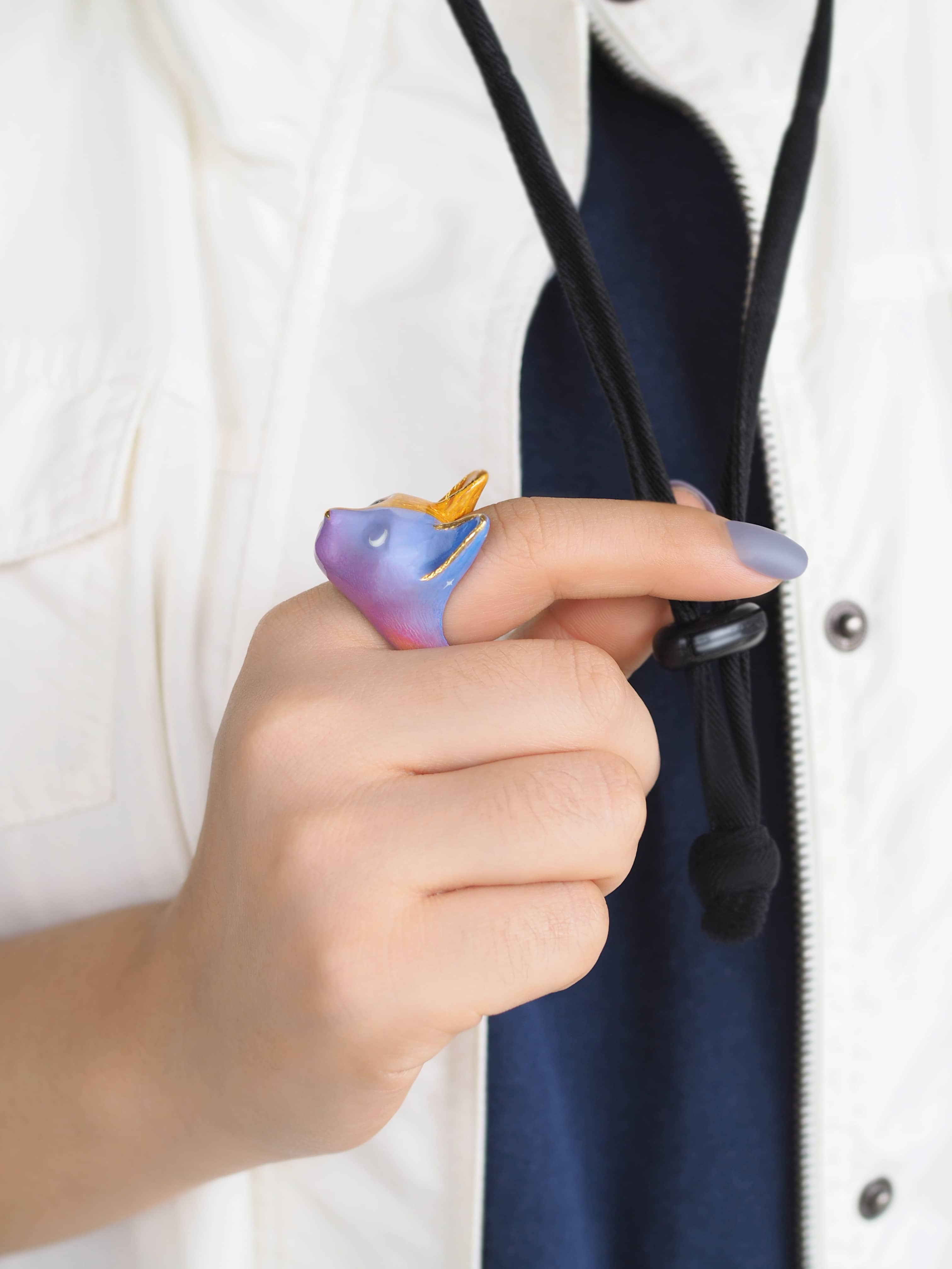 Handcrafted cat ring perfect for animal lovers and art collectors.