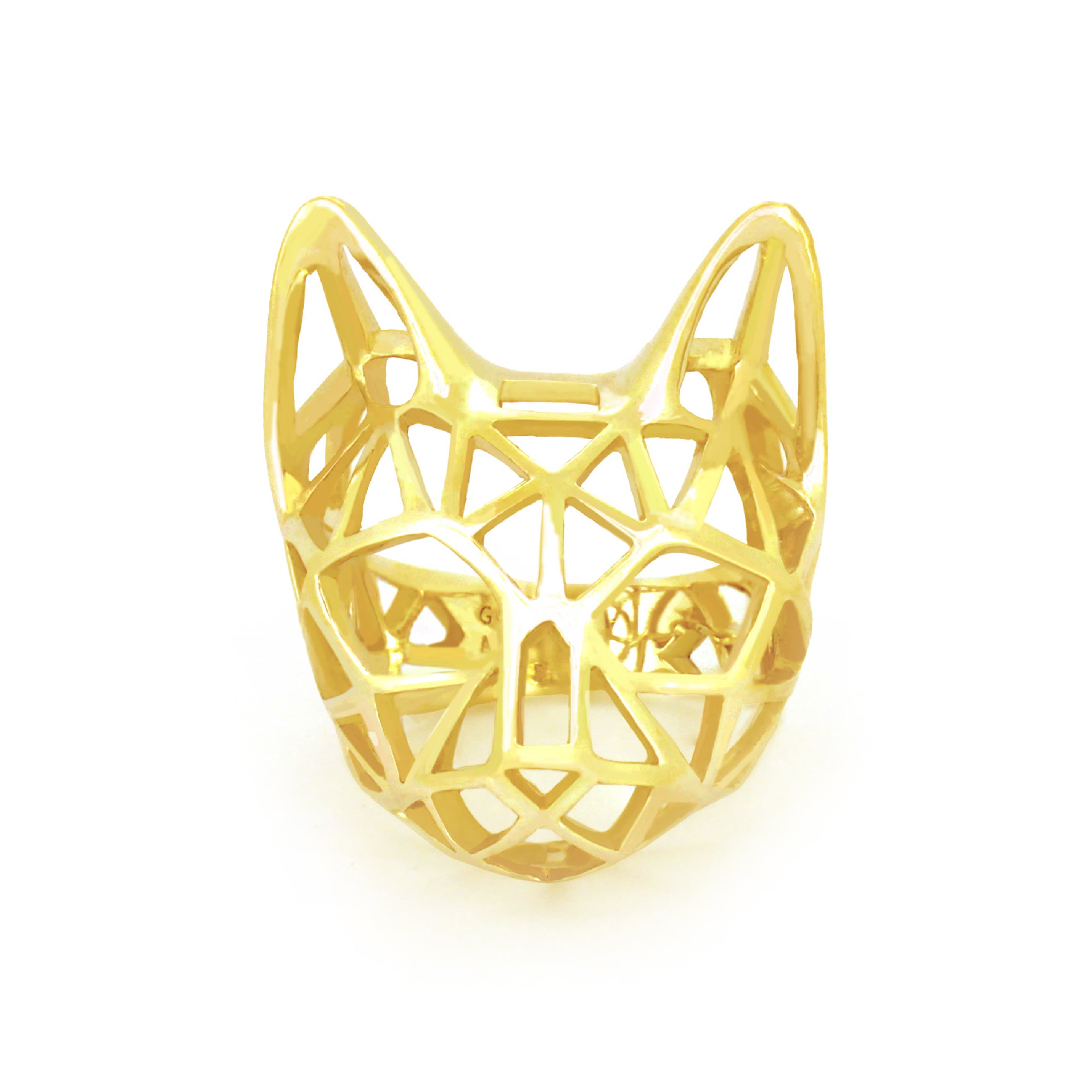 A stylish golden ring designed in the shape of a cat's head.