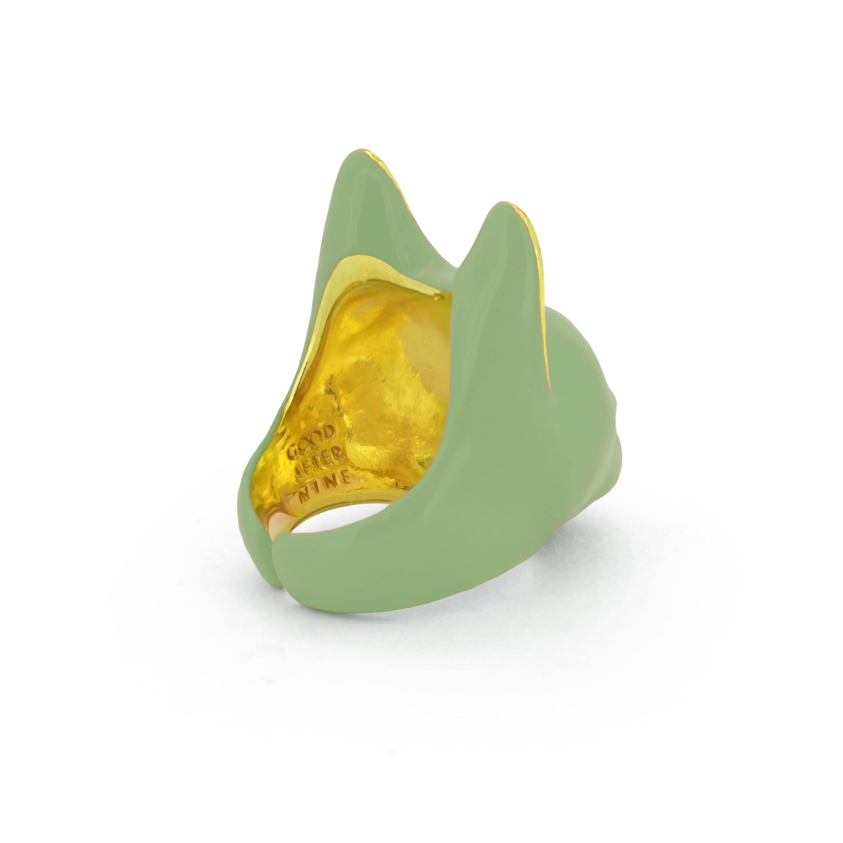 A green cat ring with gold accents on the ears and a small gold nose