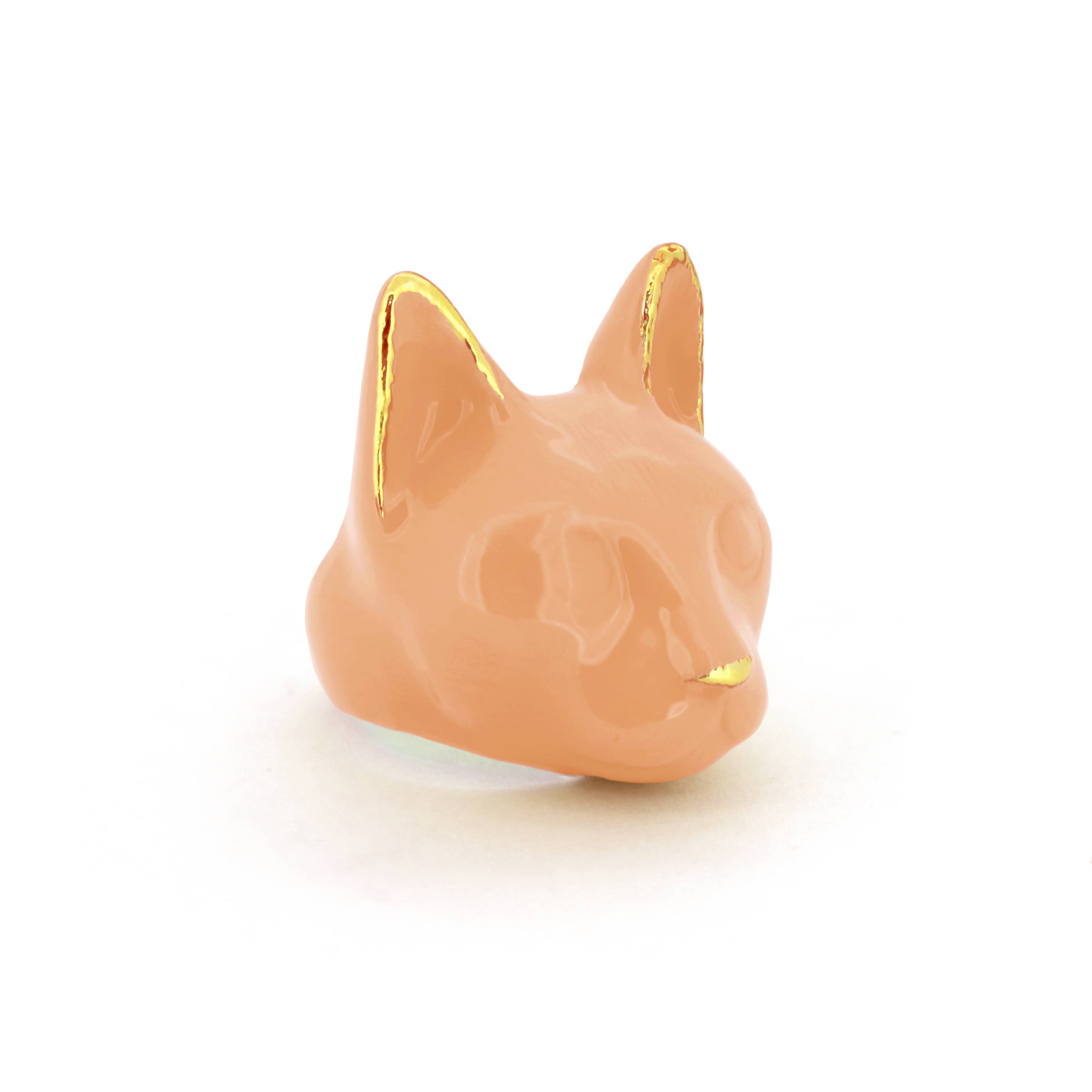A orange cat's head ring with gold accents on the ears and a small gold nose, perfect for cat lovers.