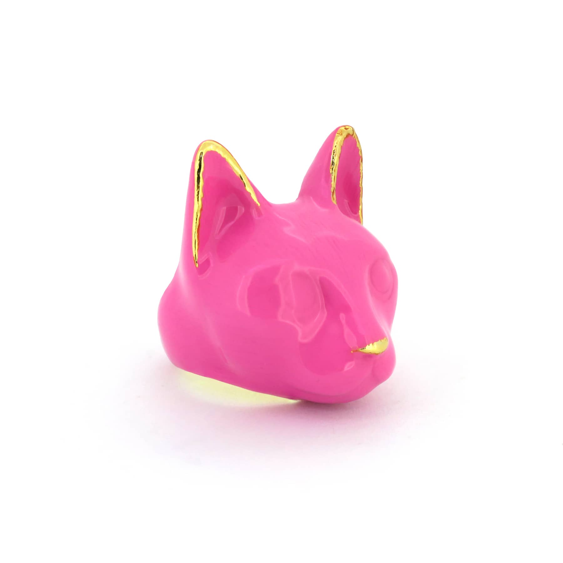A pink cat's head ring with gold accents on the ears and a small gold nose, perfect for fashion lovers.