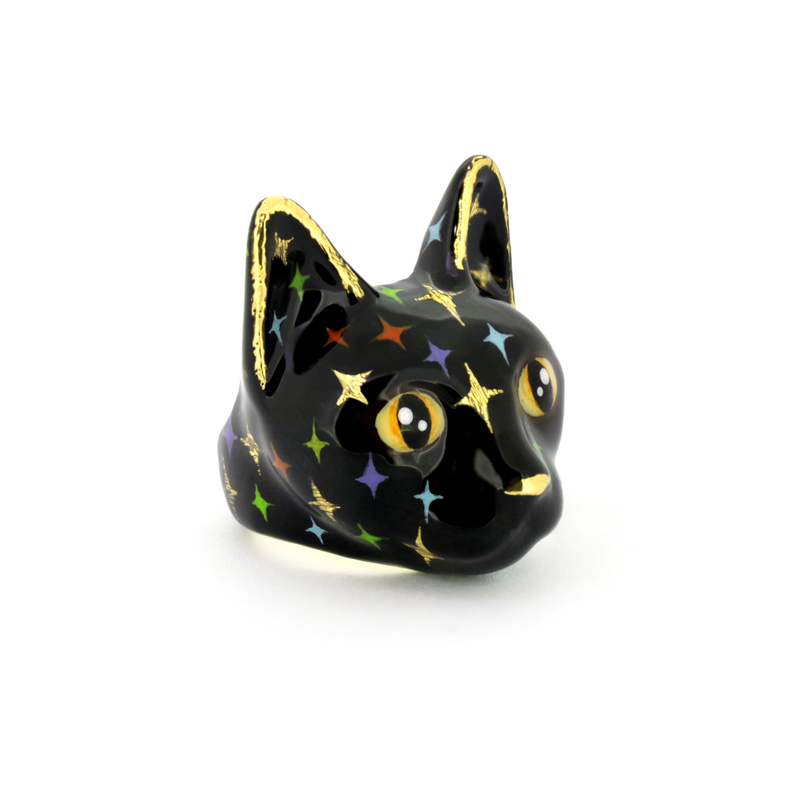 Unique black cat ring featuring yellow eyes and twinkle details on its face, perfect for cat lovers.