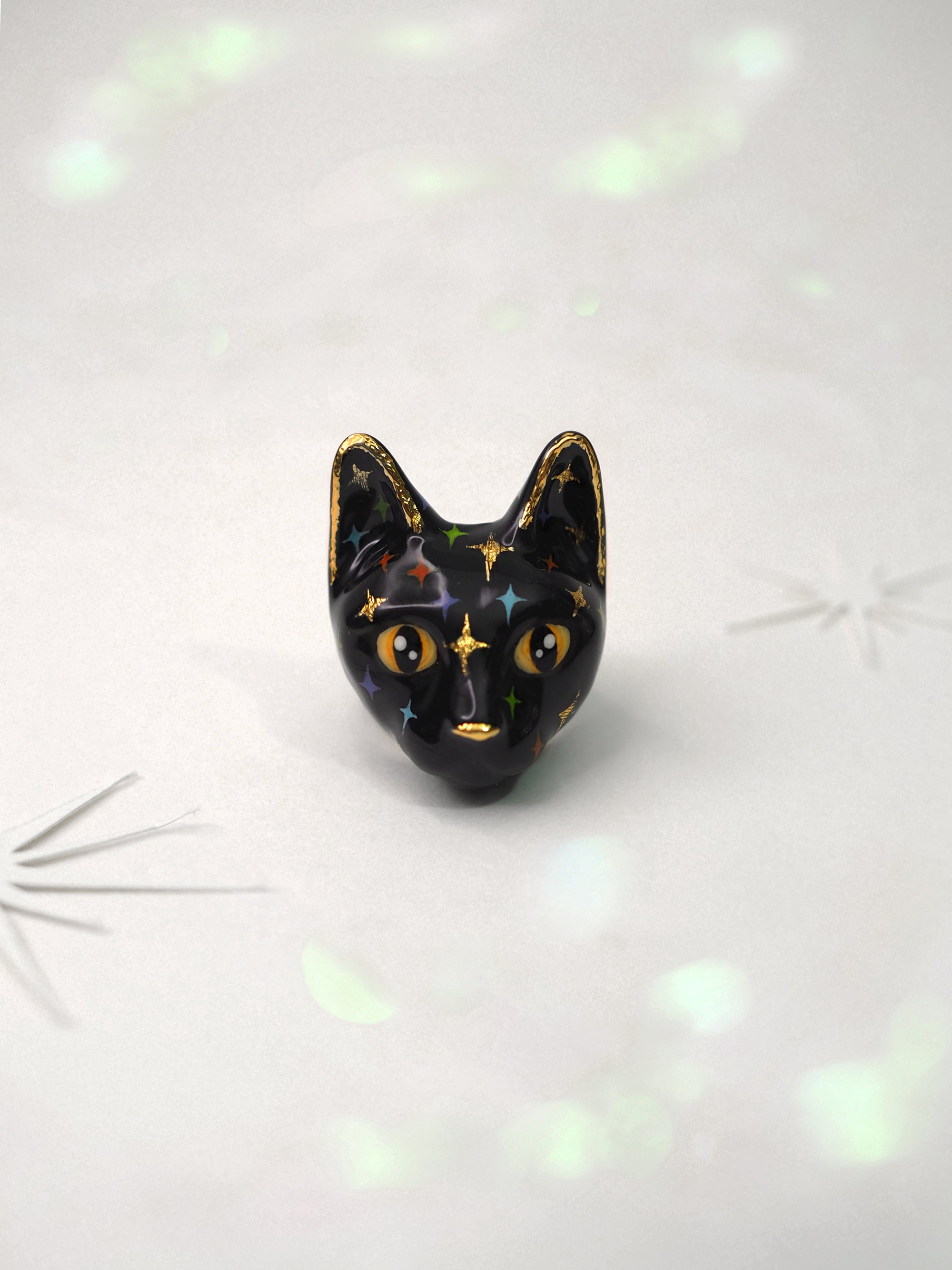 Black cat face rings with playful design featuring colorful twinkles details