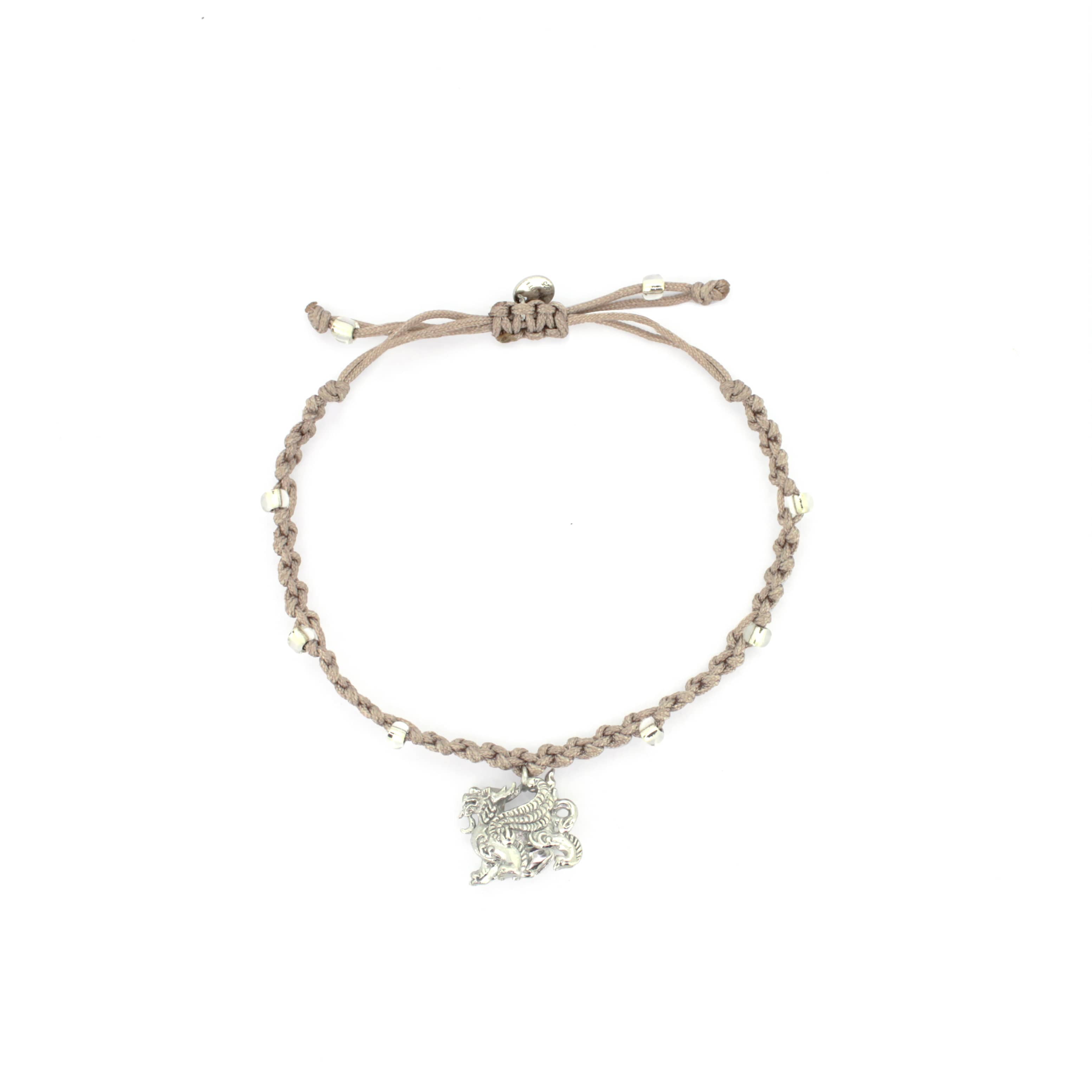 A beige bracelet with a silver Pixiu charm