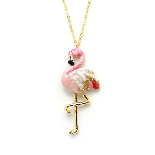 Stylish pink flamingo pendant on a gold chain.