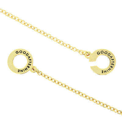 Golden necklace showcasing GoodAfterNine logo detail.