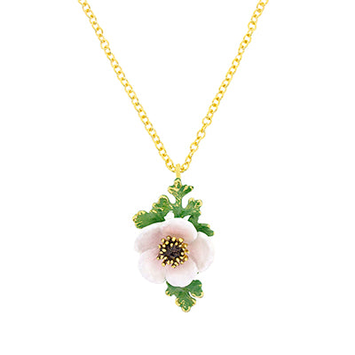Beautiful necklace with a light pink, white flower pendant and green leaves on a golden chain.