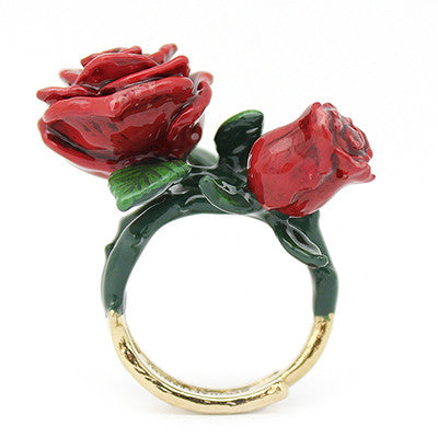 Handmade floral ring designed as red roses, featuring intricate details and green leaves