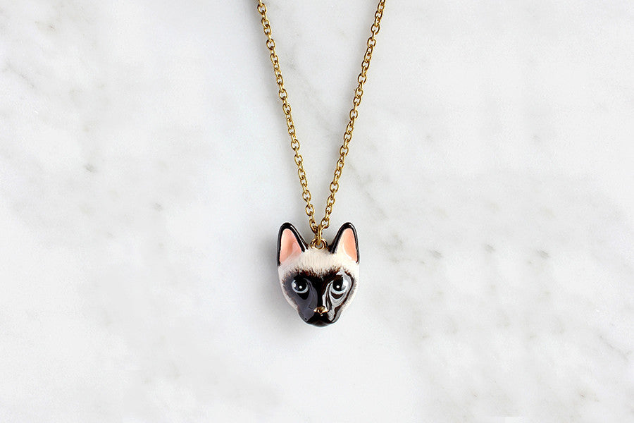 Charming Siamese cat pendant necklace on a gold chain