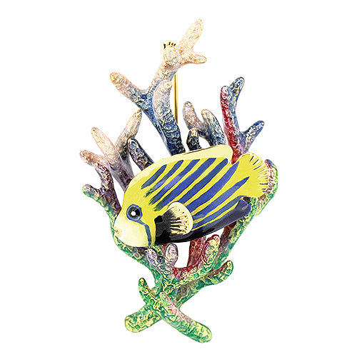 An enamel fish brooch with yellow and blue stripes, attached to a colorful coral piece.
