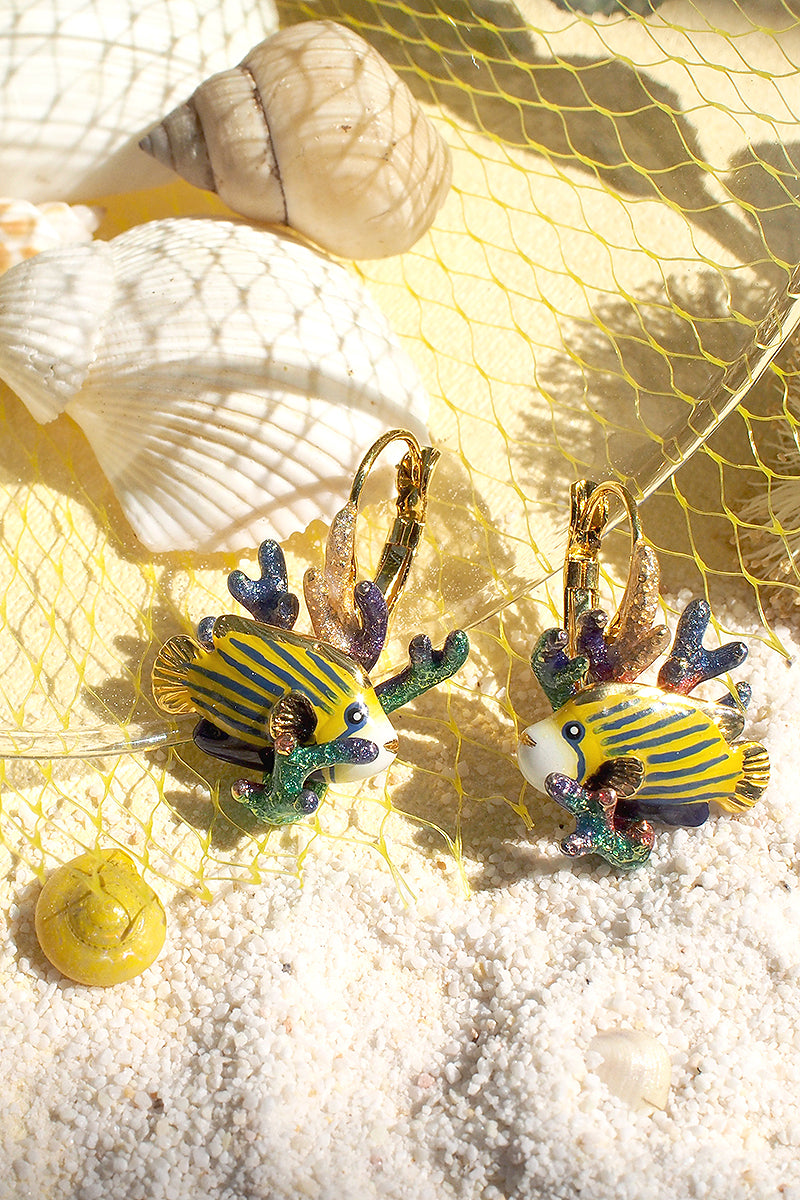 Unique beach-themed earrings featuring colorful fish with coral on a sandy background, ideal for summer fashion.