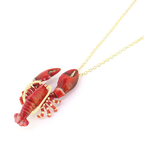 Red lobster-shaped pendant necklace with gold accents on a delicate chain.
