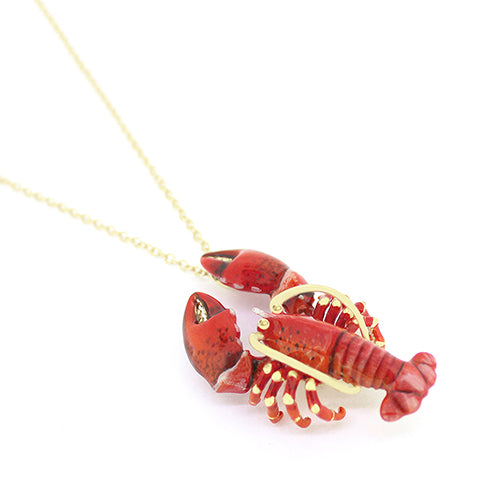 Beautiful red lobster-shaped pendant necklace with gold accents on a delicate chain.