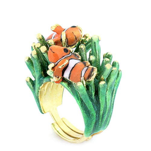 A whimsical ring featuring two clownfish on vibrant green coral.