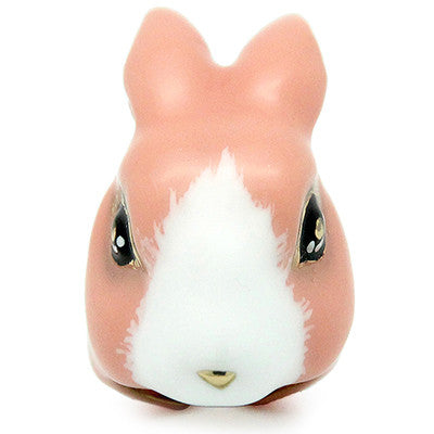 A cute ring of an orange pink bunny with large, expressive eyes.