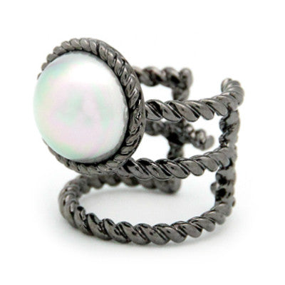 Unique ring with a braided rope design and a moon-like pearl.