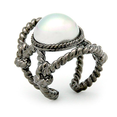 Unique ring with a large costume pearl surrounded by twisted rope design.