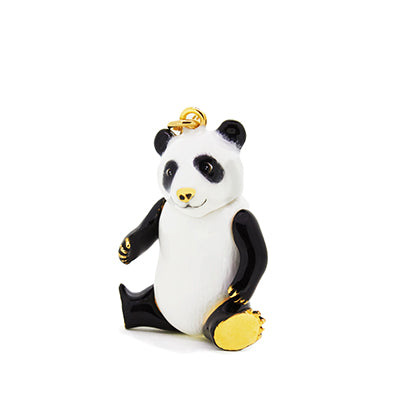 Nature-inspired black and white panda pendant on a gold chain, perfect for animal lovers.