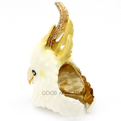 Beautiful bird ring featuring cockatoo design with white and yellow details, perfect for bird lovers.