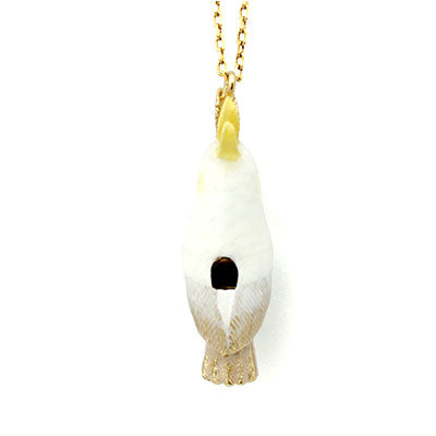 Handcrafted cockatoo-shaped whistle necklace with a gold chain.