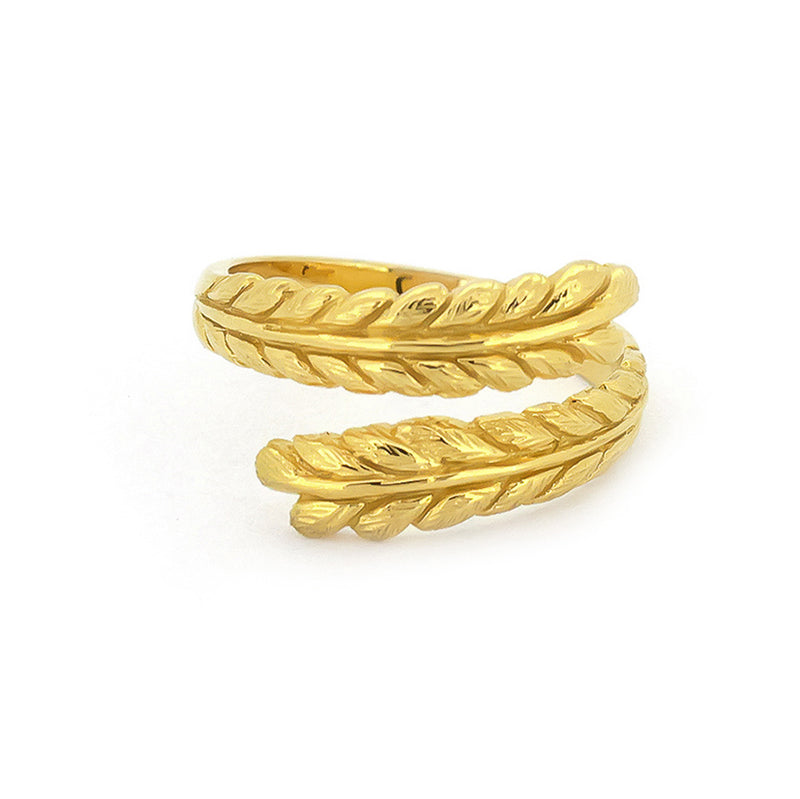 Beautiful twisted gold ring showcasing intricate leaf patterns