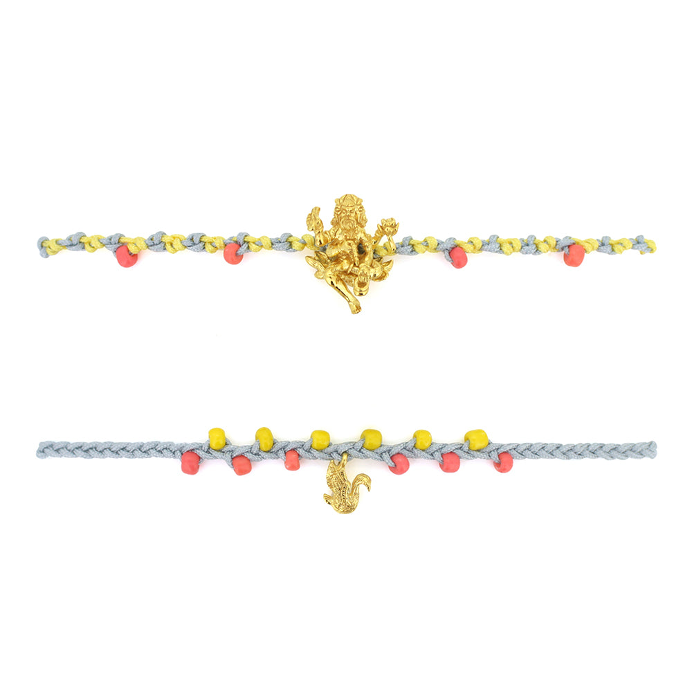 Two bracelets in light grey and yellow with pastel beads, featuring a gold Trimurti Brahma charm and a gold swan charm.