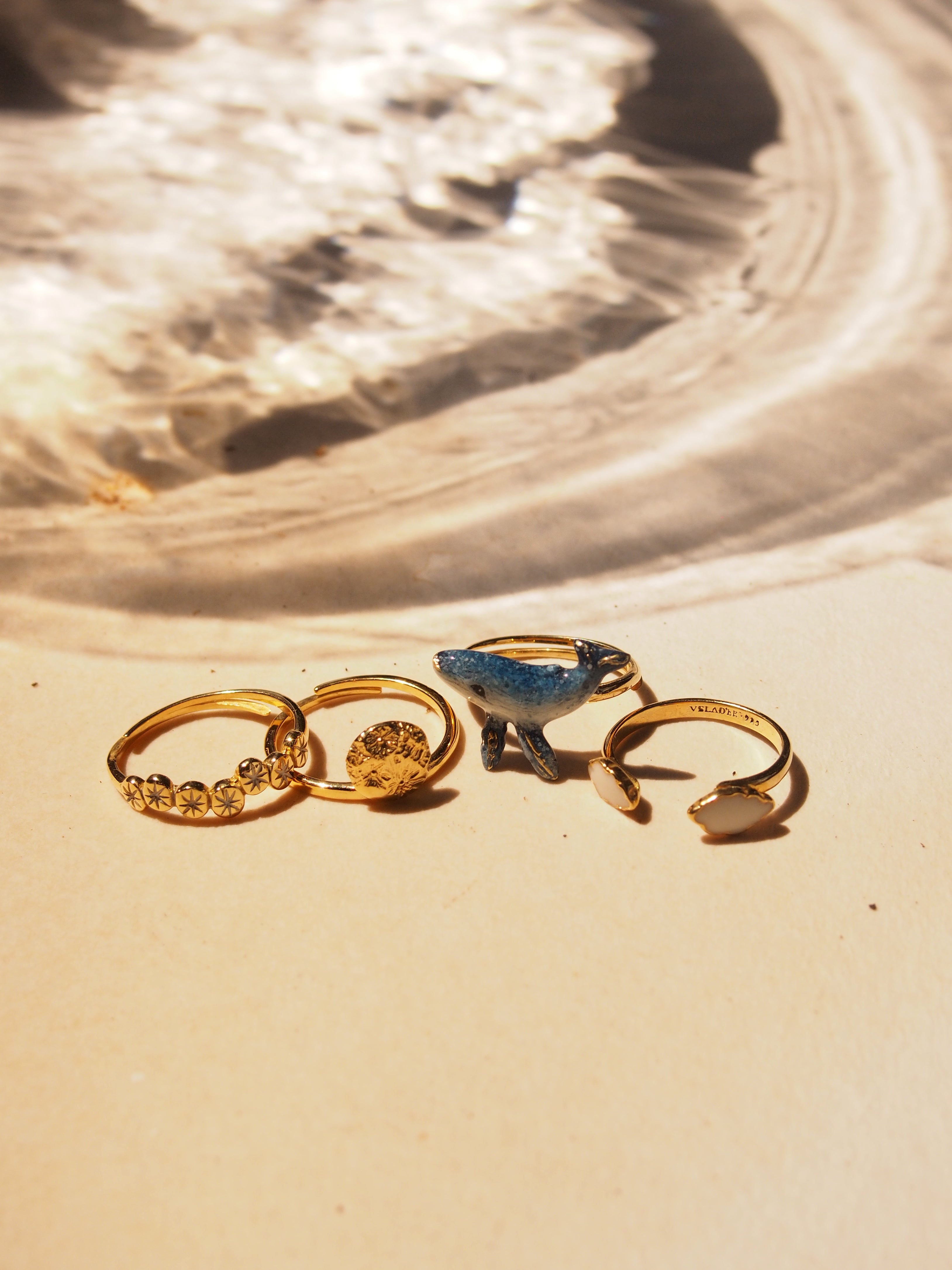 A beautiful stacking ring set featuring a whale, moon, clouds, and stars design.