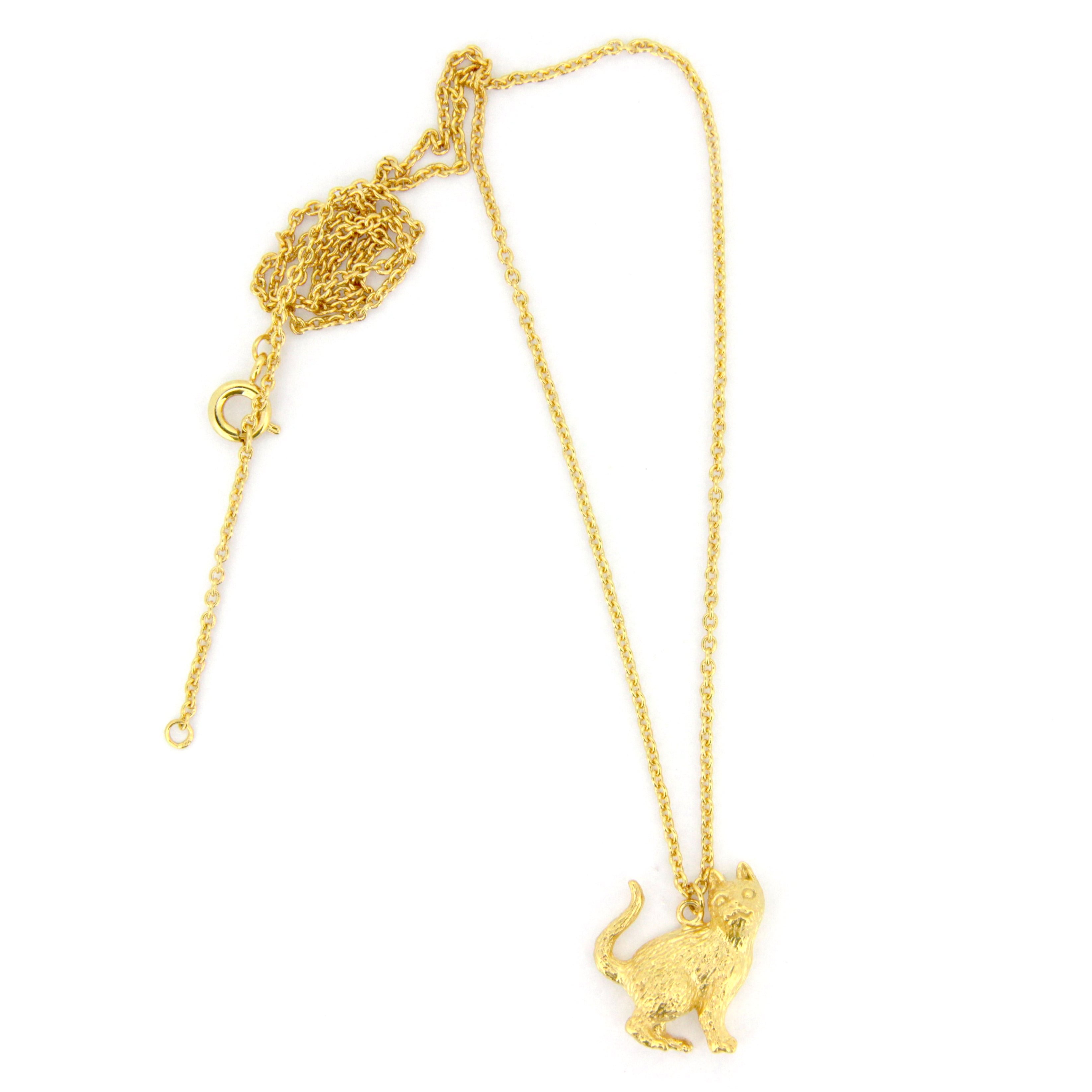 A whimsical gold pendant necklace featuring a standing up cat design, highlighting the fur's details and facial features.