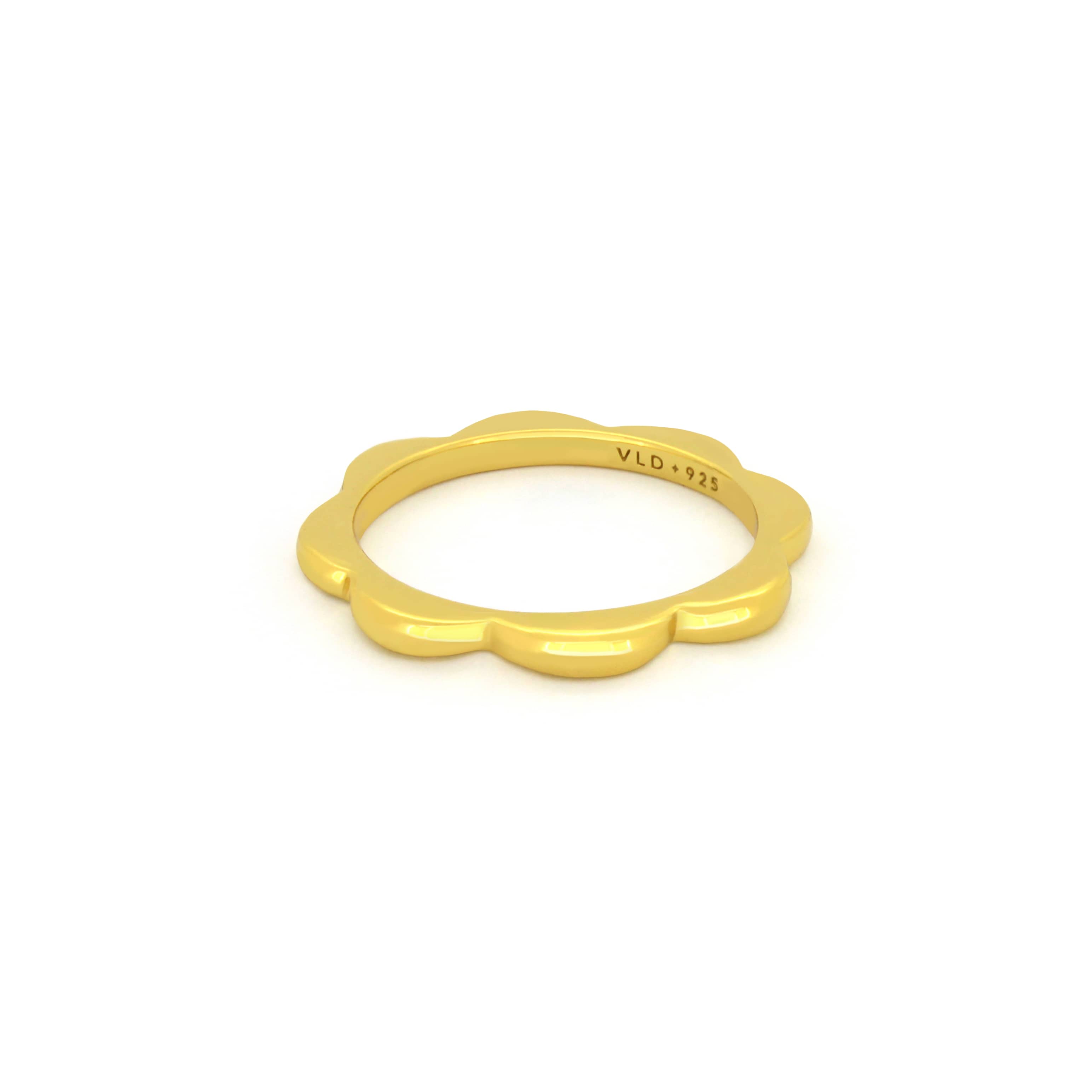 Gold-plated stacking ring with a flower design for everyday wear.