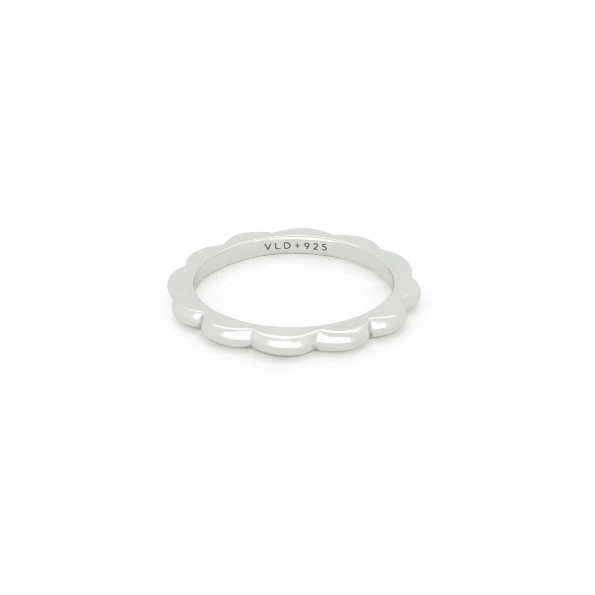 Bold minimal silver stacking ring with a curvy design.