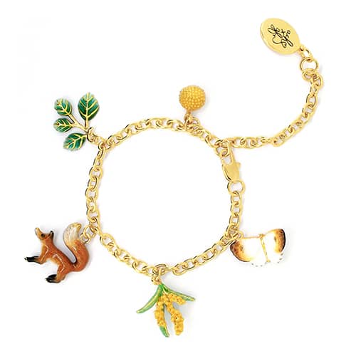 A gold charm bracelet adorned with a cute fox butterfly and nature-inspired charms.