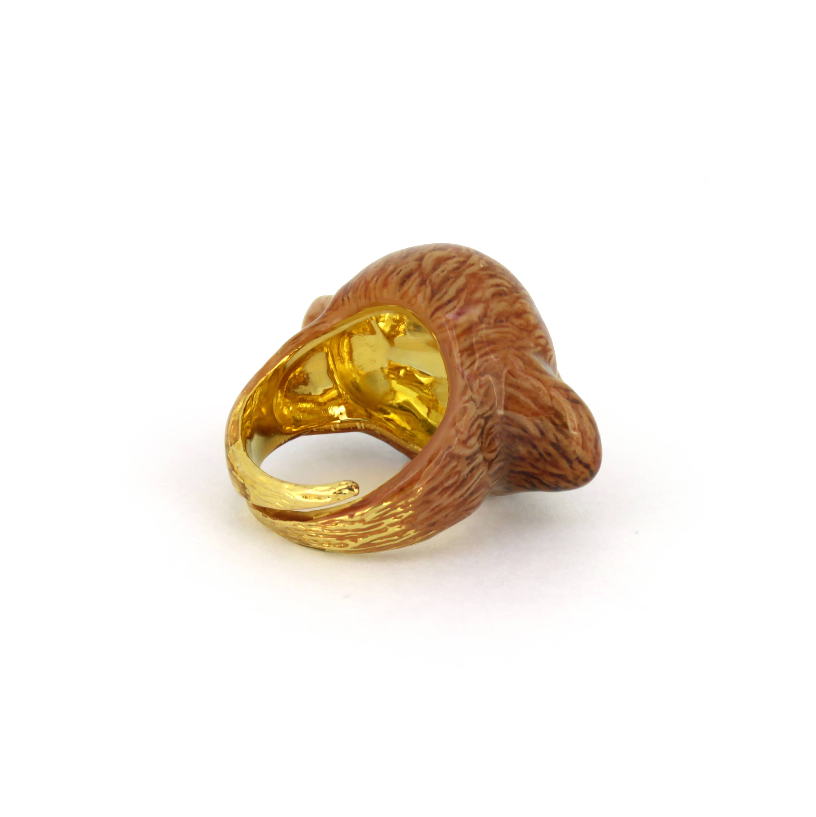 Handcrafted brown poodle ring with intricate details and vibrant colors.