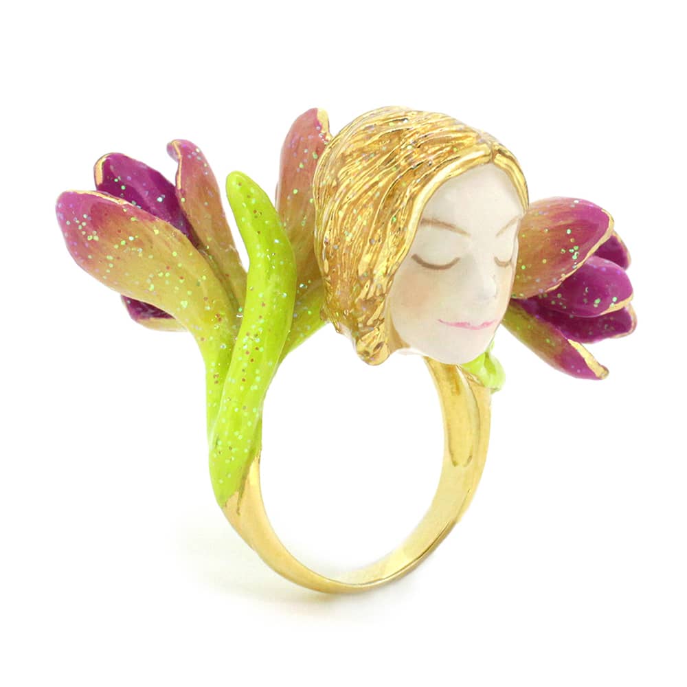 Beautifully crafted ring featuring a nymph's face surrounded by pink and green flowers