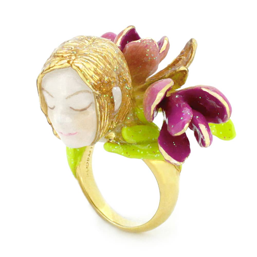 Fantasy-inspired ring featuring a nymph's face surrounded by pink and green flowers.